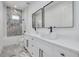 Modern bathroom with double vanity, marble shower, and soaking tub at 6012 Kipps Colony E Dr, Gulfport, FL 33707