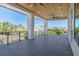 Large balcony with wood ceilings, tile flooring and view at 6012 Kipps Colony E Dr, Gulfport, FL 33707