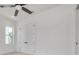 Bright bedroom with light walls, wood flooring, and double doors at 6012 Kipps Colony E Dr, Gulfport, FL 33707