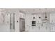 Modern kitchen with white cabinetry, stainless steel appliances, and a wine cooler at 6012 Kipps Colony E Dr, Gulfport, FL 33707