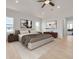 Spacious main bedroom with light wood floors and a king-size bed at 6012 Kipps Colony E Dr, Gulfport, FL 33707