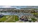 Aerial view of waterfront community with marina, golf course, and clubhouse at 6012 Kipps Colony E Dr, Gulfport, FL 33707