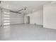 Clean and bright garage featuring an automatic door and epoxy flooring at 6012 Kipps Colony E Dr, Gulfport, FL 33707