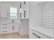 Laundry room with white shaker cabinets and quartz countertops at 6012 Kipps Colony E Dr, Gulfport, FL 33707