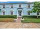 Light blue building exterior with manicured landscaping at 5176 Salmon Se Dr # A, St Petersburg, FL 33705