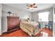 Bright bedroom with wood floors, ceiling fan, and ample closet space at 5176 Salmon Se Dr # A, St Petersburg, FL 33705