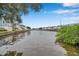 Tranquil waterfront view of a canal with boats and lush greenery at 5176 Salmon Se Dr # A, St Petersburg, FL 33705