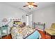 Cozy bedroom with floral bedding and wood floors at 5176 Salmon Se Dr # A, St Petersburg, FL 33705