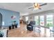 Bright living room featuring a recliner, and access to a patio overlooking the water at 5176 Salmon Se Dr # A, St Petersburg, FL 33705