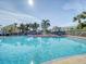 Community pool and spa surrounded by palm trees at 5176 Salmon Se Dr # A, St Petersburg, FL 33705