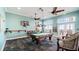 Game room featuring a pool table, comfortable seating, and a TV at 5176 Salmon Se Dr # A, St Petersburg, FL 33705