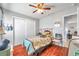 Secondary bedroom with wood floors, ceiling fan and closet at 5176 Salmon Se Dr # A, St Petersburg, FL 33705