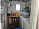 Basement with a washer and dryer hookup and storage for cleaning supplies at 15536 Bristol E Cir, Clearwater, FL 33764