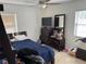 Bedroom features a dresser and mirror with a bed at 15536 Bristol E Cir, Clearwater, FL 33764