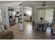 Open-concept dining area featuring tile floors, modern lighting, and seamless access to the adjacent kitchen at 15536 Bristol E Cir, Clearwater, FL 33764