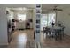 Bright living room connected to the kitchen and dining, offering pool views and modern appliances at 15536 Bristol E Cir, Clearwater, FL 33764