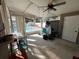 Enclosed patio with a ceiling fan provides access and views of the sparkling pool at 15536 Bristol E Cir, Clearwater, FL 33764