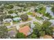 Aerial view of a residential neighborhood showing homes and landscaping at 1627 Dander Dr, Holiday, FL 34690