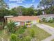Aerial view of charming ranch home with landscaped yard at 1627 Dander Dr, Holiday, FL 34690