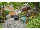 Outdoor patio with pergola, bar, and seating area, perfect for entertaining at 1627 Dander Dr, Holiday, FL 34690