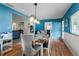 Dining room showcasing stylish light fixture and easy access to the kitchen and living spaces at 7226 Onyx N Dr, St Petersburg, FL 33702