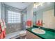 Bathroom featuring a glass-enclosed shower, modern fixtures, and ample lighting at 739 Winterbrooke Way, Sun City Center, FL 33573