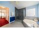 Bathroom with glass-enclosed shower and soaking tub at 739 Winterbrooke Way, Sun City Center, FL 33573