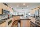 Kitchen with a center island, modern appliances, and ample cabinet space at 739 Winterbrooke Way, Sun City Center, FL 33573