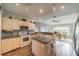 Bright kitchen featuring an island, modern appliances, and breakfast nook at 739 Winterbrooke Way, Sun City Center, FL 33573