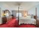 Spacious main bedroom featuring a four-poster bed and classic decor at 739 Winterbrooke Way, Sun City Center, FL 33573