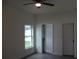 Spacious bedroom with new flooring and an adjacent bathroom at 4004 E Osborne Ave, Tampa, FL 33610