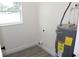 Laundry room includes a new water heater at 4004 E Osborne Ave, Tampa, FL 33610
