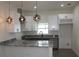 Modern kitchen with white cabinets and granite countertops at 4004 E Osborne Ave, Tampa, FL 33610