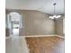 Spacious dining room featuring hardwood floors and an arched entryway at 12739 Standbridge Dr, Riverview, FL 33579