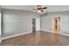 Primary bedroom with ceiling fan and access to bathroom at 12739 Standbridge Dr, Riverview, FL 33579