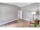 Spacious bedroom with wood-look tile flooring and an open doorway at 12739 Standbridge Dr, Riverview, FL 33579