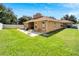 Back exterior view of house showcasing a large backyard at 12739 Standbridge Dr, Riverview, FL 33579