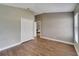 Bedroom with wood-look tile floors and a double-door closet at 12739 Standbridge Dr, Riverview, FL 33579