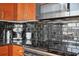 Modern kitchen with black tile backsplash and stainless steel appliances at 777 N Ashley Dr # 1606, Tampa, FL 33602