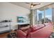 Living room with red sectional sofa and city views at 777 N Ashley Dr # 1606, Tampa, FL 33602
