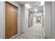 Clean and well-lit hallway with wood doors and carpeted floors at 777 N Ashley Dr # 1606, Tampa, FL 33602