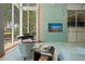 Relaxing lounge with comfortable seating, piano, and large windows at 777 N Ashley Dr # 1606, Tampa, FL 33602