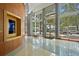 Elegant lobby with wood paneling, large windows, and city views at 777 N Ashley Dr # 1606, Tampa, FL 33602