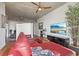 Open living room featuring a red sectional sofa and city view at 777 N Ashley Dr # 1606, Tampa, FL 33602