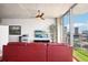 Modern living room with city view and red leather sofa at 777 N Ashley Dr # 1606, Tampa, FL 33602