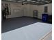 Attached garage with epoxy flooring and storage shelving at 34735 Double Eagle Ct, Zephyrhills, FL 33541