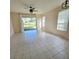 Spacious living room featuring tile floors and access to a screened patio at 34735 Double Eagle Ct, Zephyrhills, FL 33541