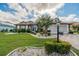 Single-Gathering home with manicured lawn, landscaping, and a paver driveway at 739 Winterbrooke Way, Sun City Center, FL 33573