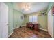 Home office with built-in desk and hardwood floors at 739 Winterbrooke Way, Sun City Center, FL 33573