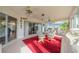 Spacious sunroom with glass doors and seating area at 739 Winterbrooke Way, Sun City Center, FL 33573